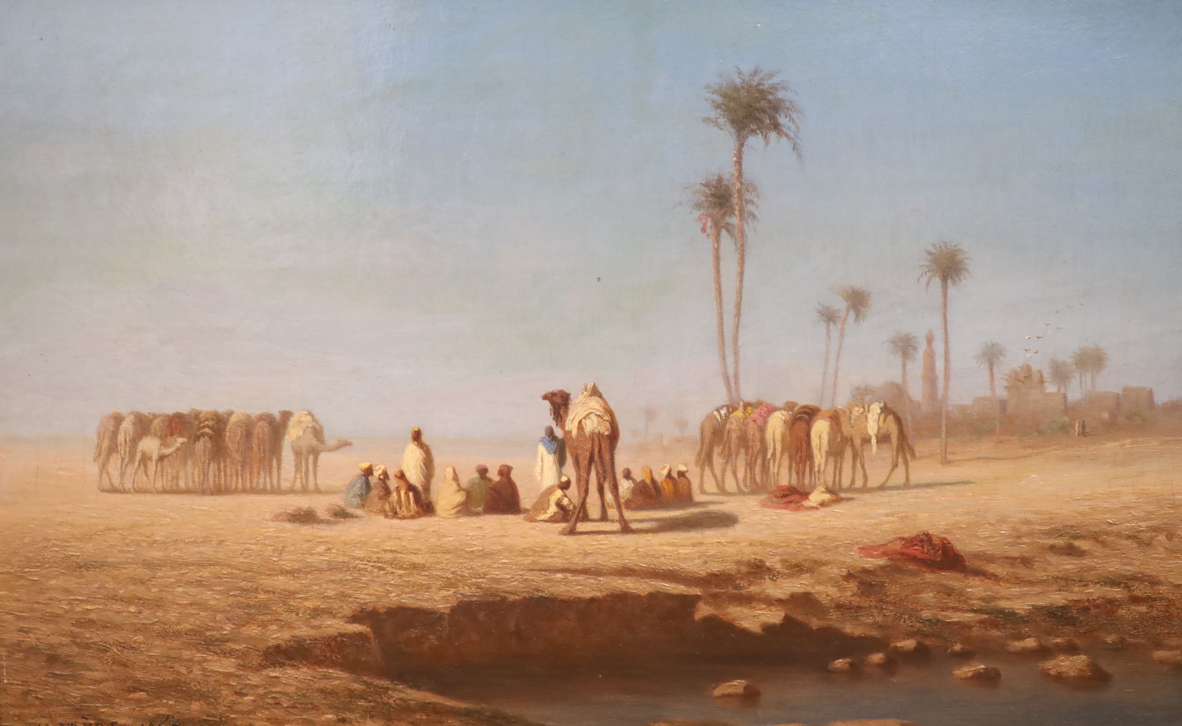 Théodore Frère (French, 1814-1888) Figures and camels beside a watering hole 10 x 15.75in.